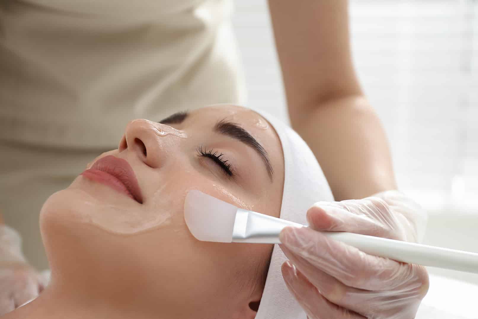 woman resting during chemical peel dermatology treatment at Halo Skin Institute